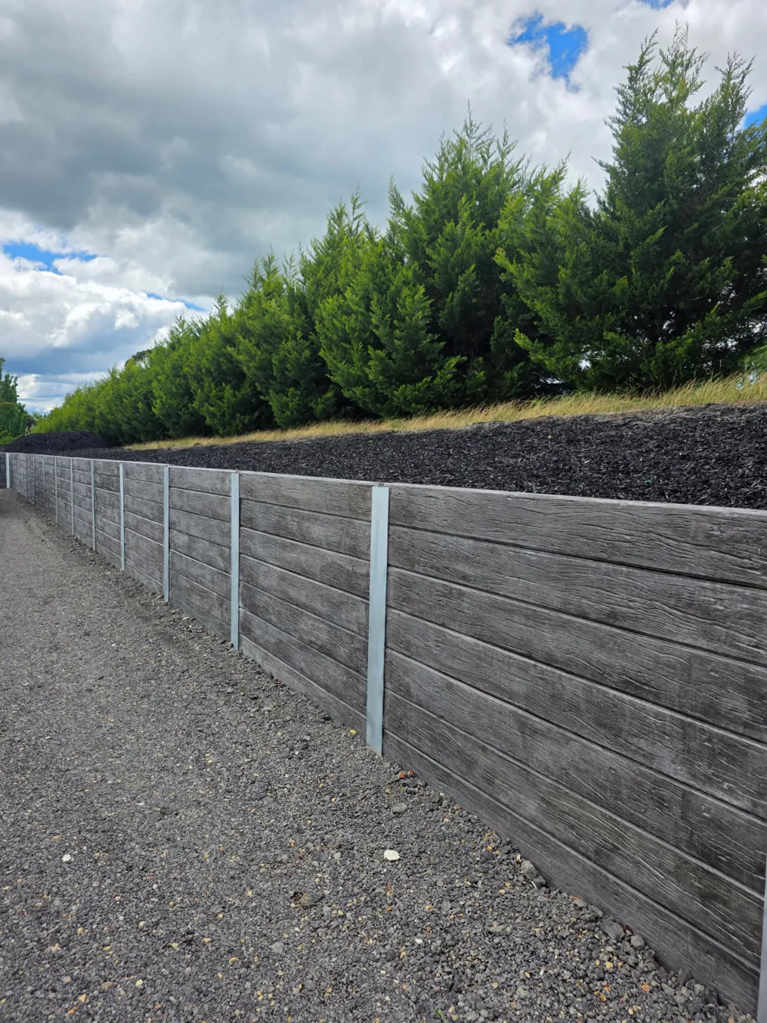 Charcoal woodgrain sleeper retaining wall