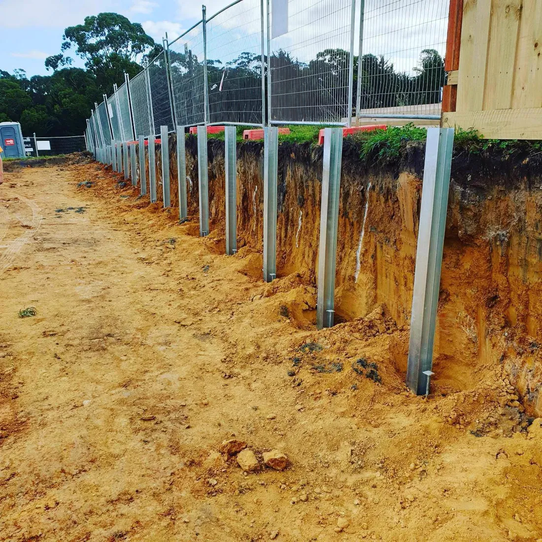 Steel post footings set for a retaining wall