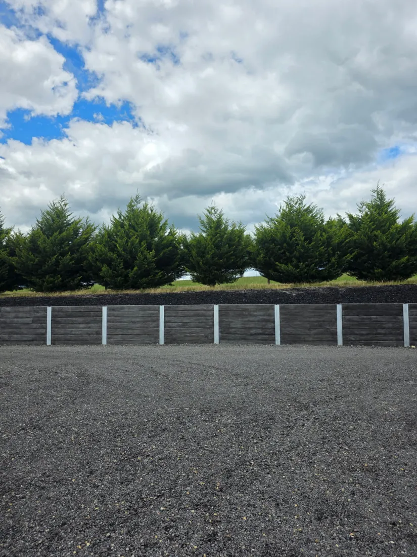 Finished charcoal sleeper retaining wall