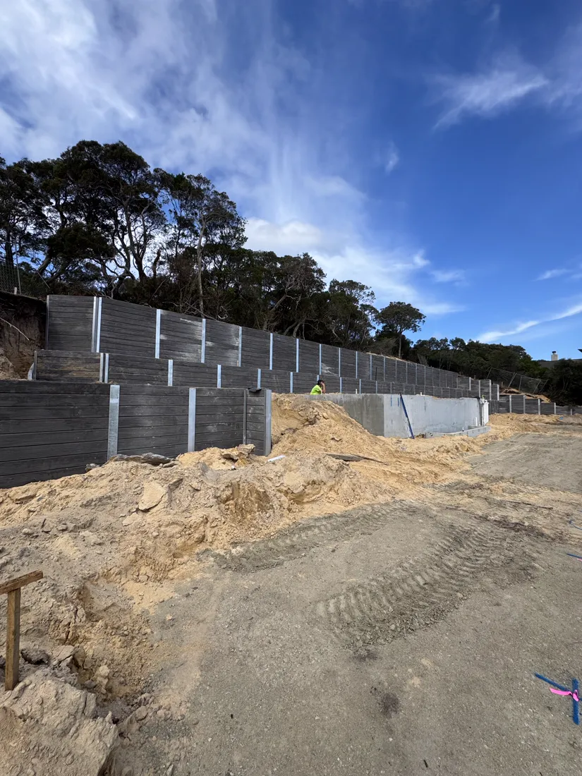 Tall multi-tier sleeper retaining walls on a large civil site